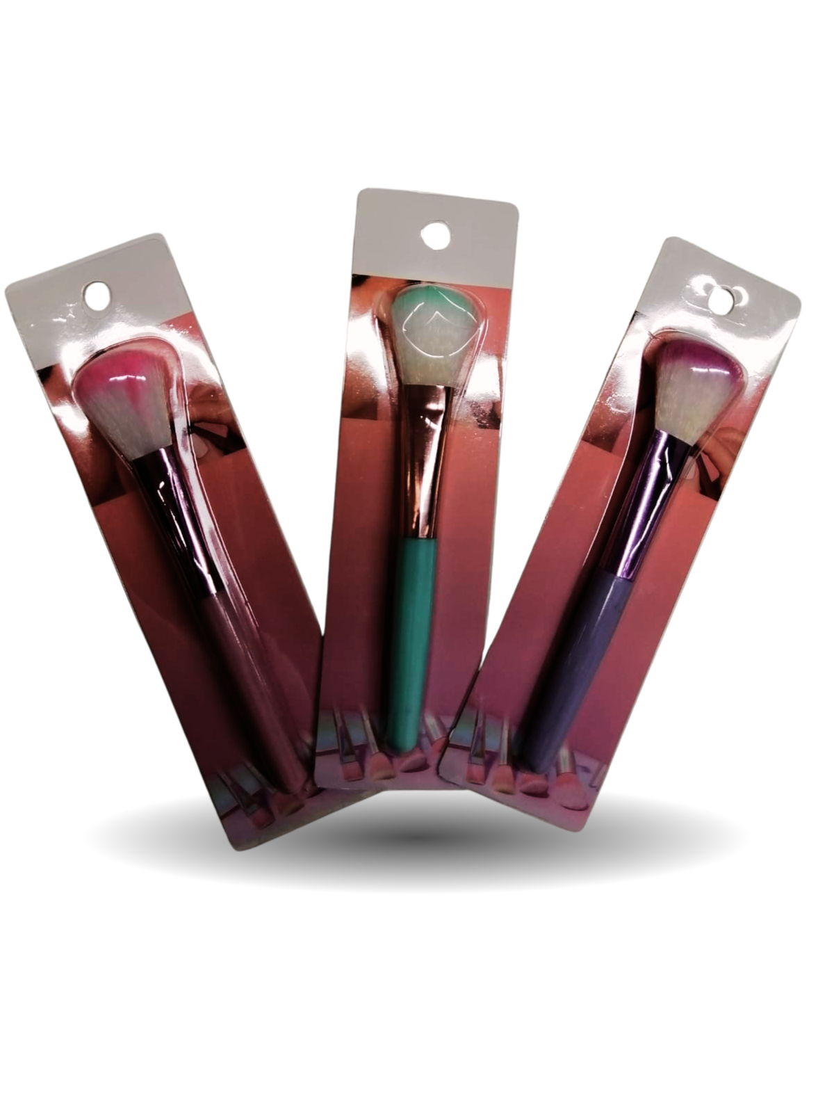 Brocha cosmética de colores en blister